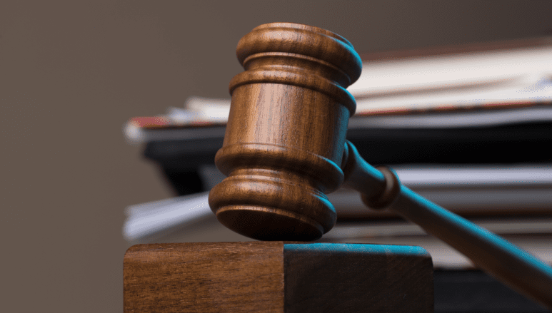 hammer-documents-lying-table